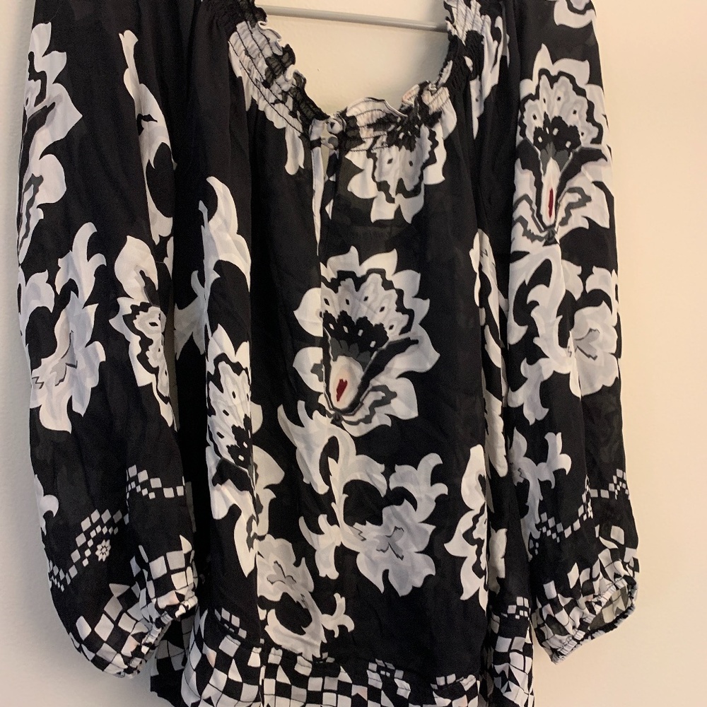 White House Black Market 100% silk flowery blouse with tassel size large.